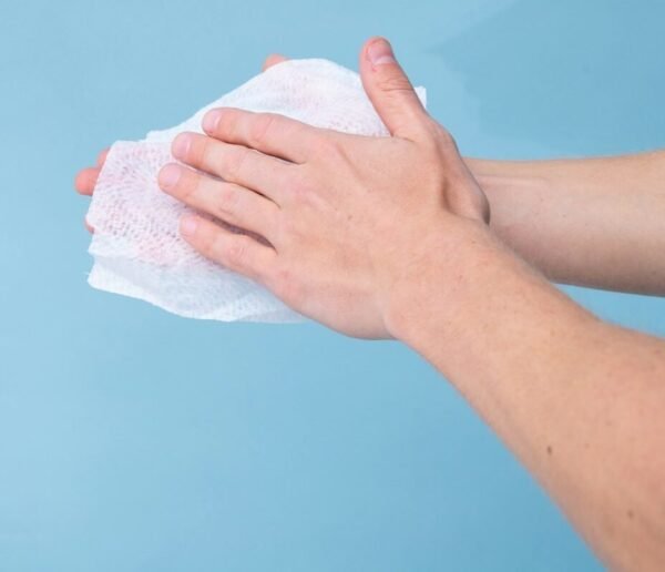 person holding white tissue paper